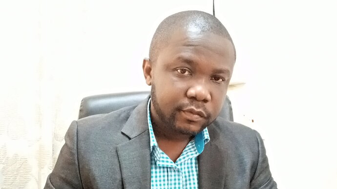 Shoulder shot of an African man looking at the camera