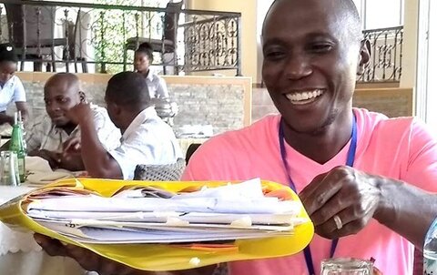 One of the Nakaseke team members has packed his plan to take back to the district